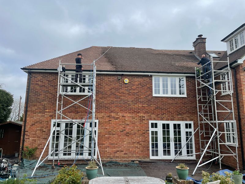 Roof cleaning carried out safely from scaffold towers by The Roof Moss Cleaners in Buntingford